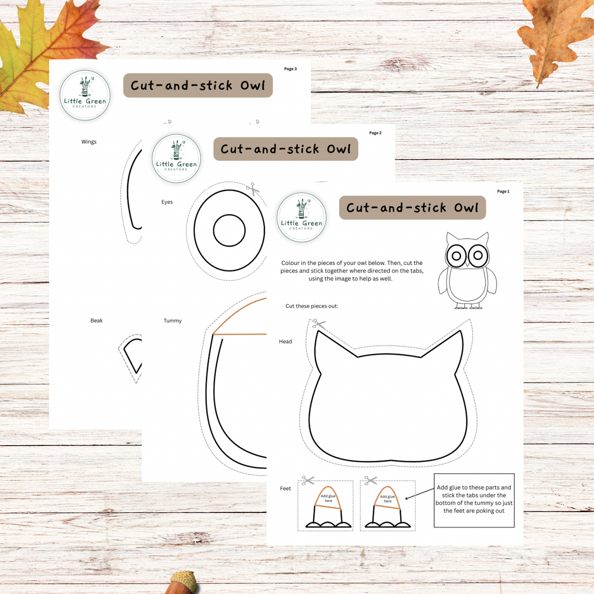 Two printable craft activity sheets for making an owl cut-and-stick, displayed on a light wood background with autumn leaves. The sheets feature black line drawings of an owl's parts (wings, eyes, beak, head, feet) with instructions and a color guide.